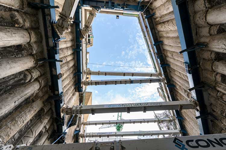 Ground level looking up at four levels of temporary propping at Cambridge House