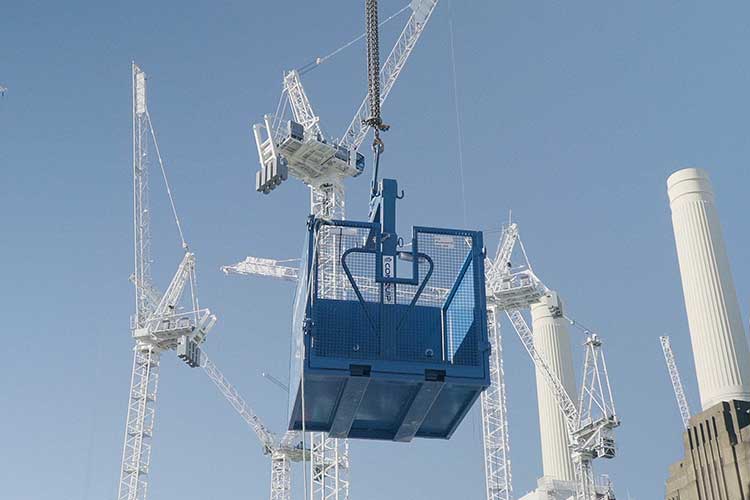 crane pallet forks in use with crane forks cage for safe lifting of palletised load